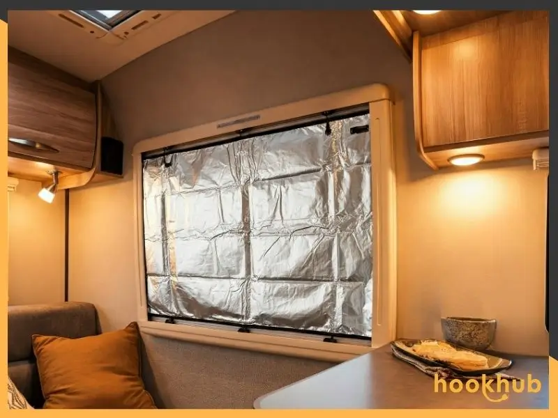 An RV window with reflective window cover