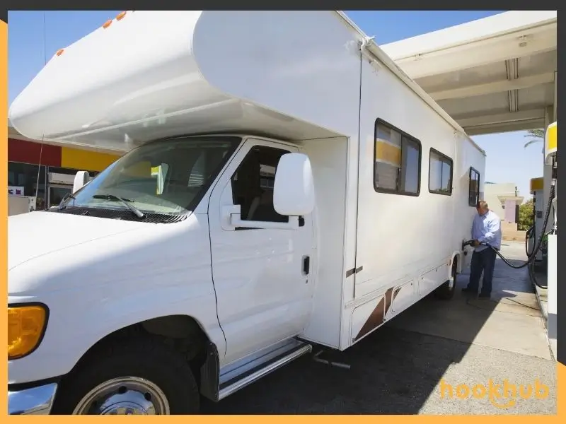 Man refueling Class C motorhome